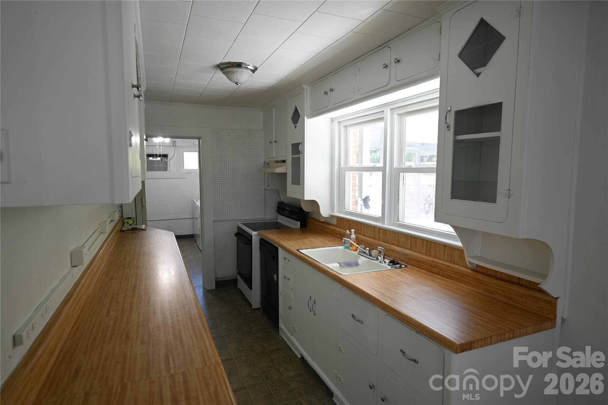 Single Family Residence at 105 Owens Avenue NE, Drexel, photo 13 of 38
