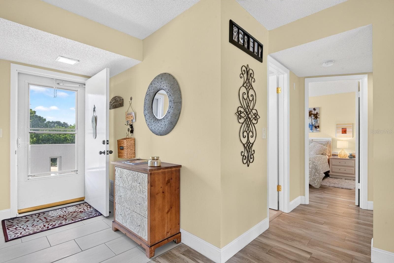 Entrance showing hallway to Guestbedroom and Guest Bath. - 4240 IRONWOOD CIR #302A, BRADENTON