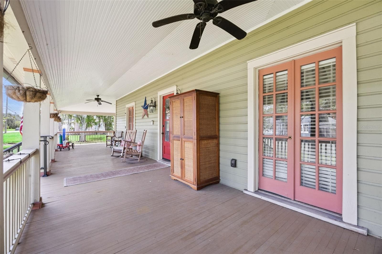 Slow down and stay awhile — multiple seating areas make the wraparound porch an extension of the home's living space. - 2201 CELERY AVE, SANFORD