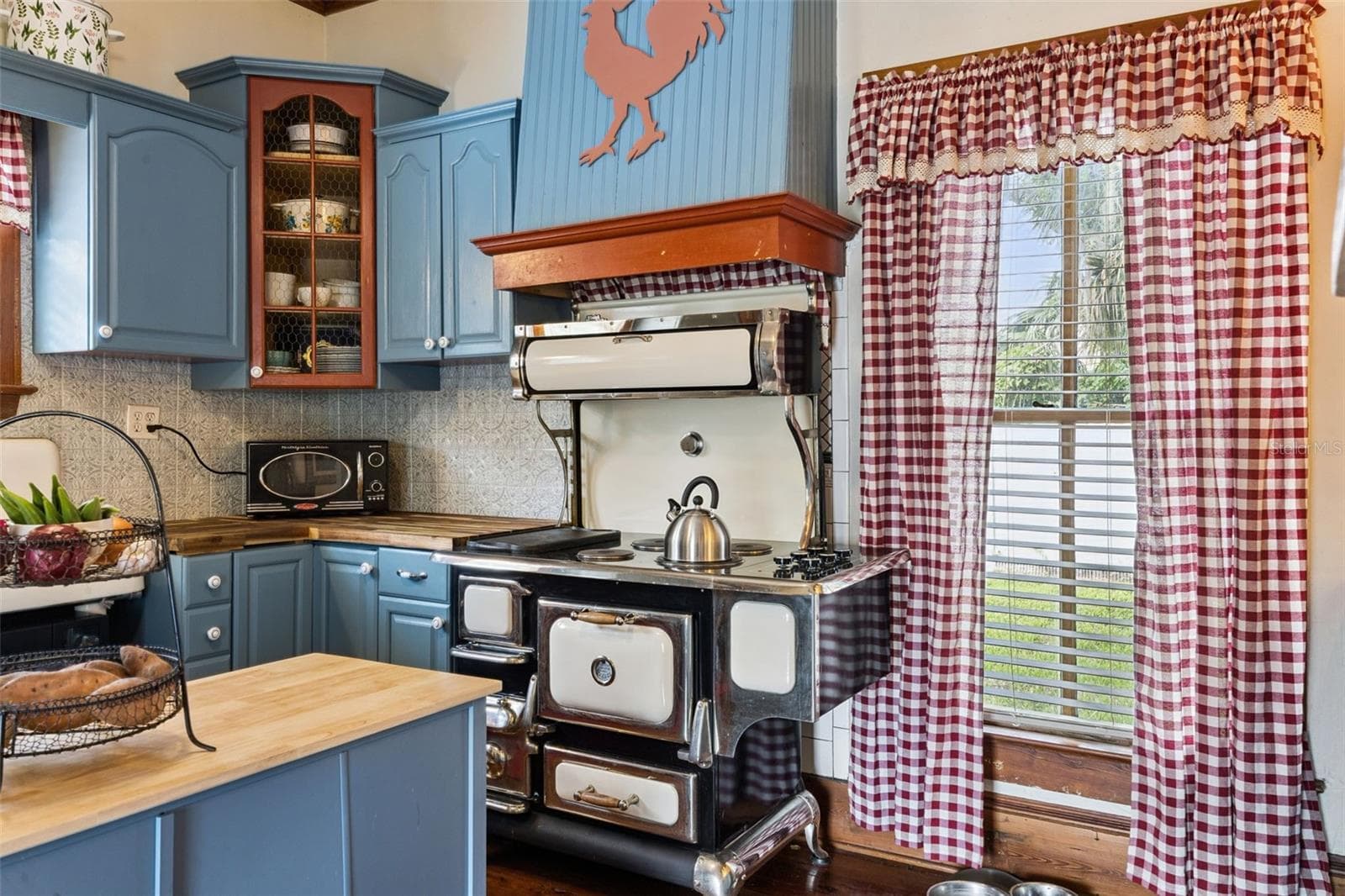 A statement range adds unforgettable vintage character to a kitchen designed to complement the home's history. - 2201 CELERY AVE, SANFORD