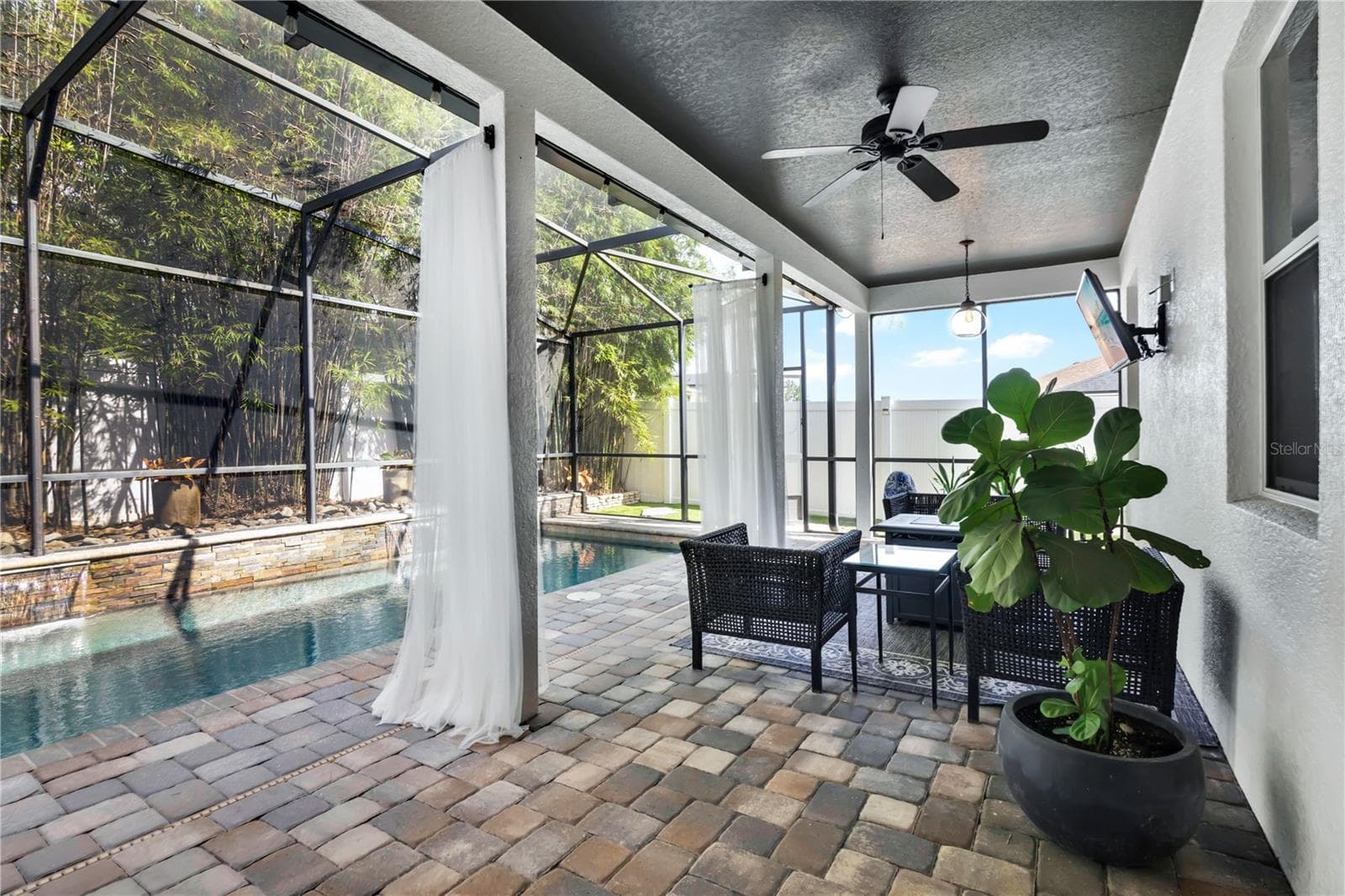 Outdoor seating under covered patio - 13547 PITANGA ST, CLERMONT