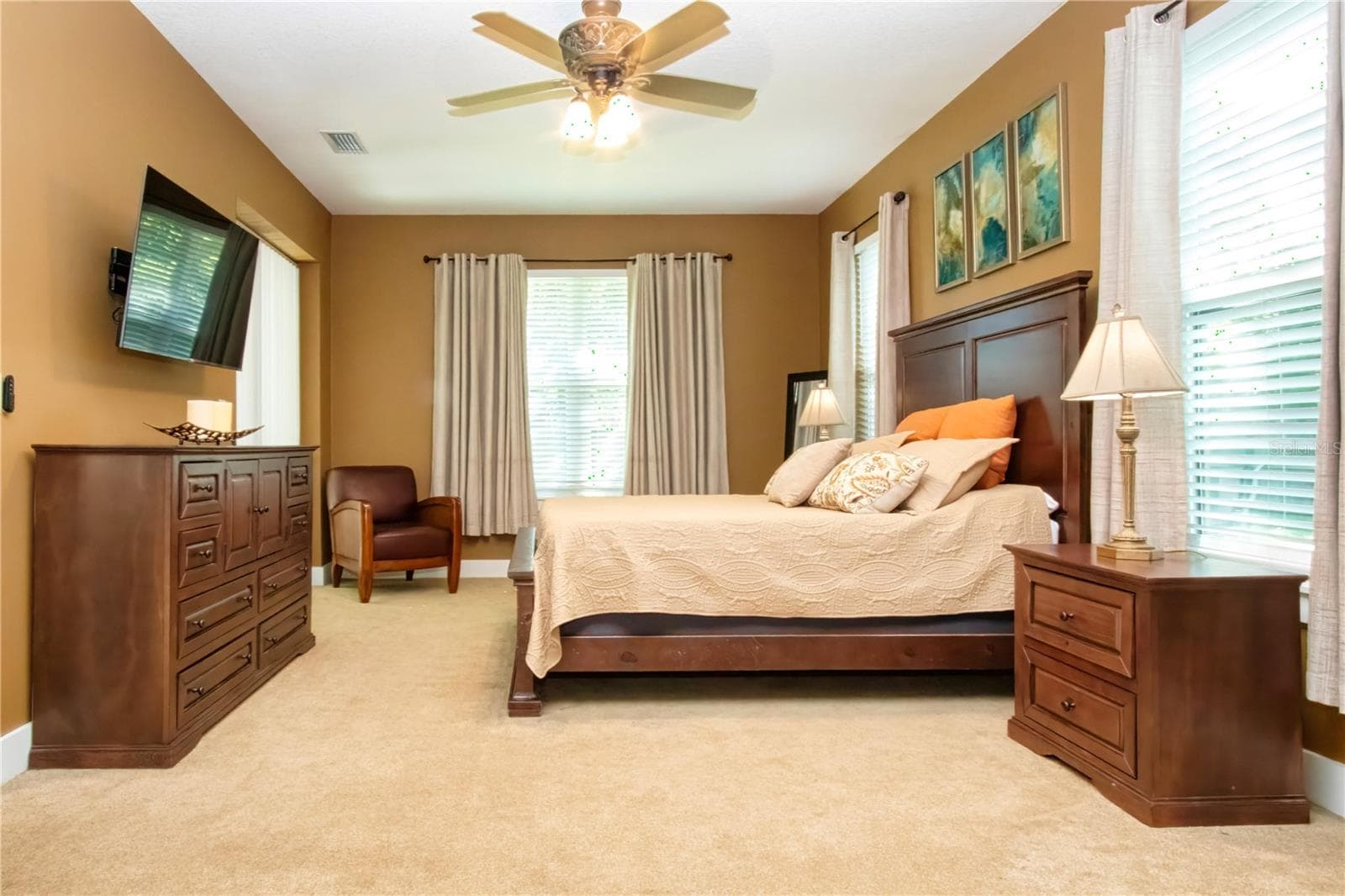 Owners suite is located on the N side of the home with a picture window and a vew of the fenced in area - 1605 BUTCH CASSIDY TRL, WIMAUMA