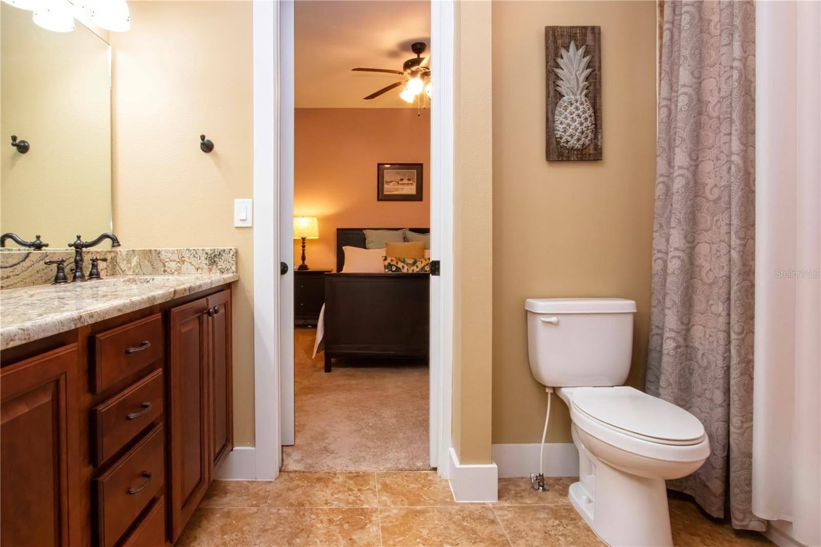 jack and Jill bath lookin in from bedroom 2 to bedroom 3 - 1605 BUTCH CASSIDY TRL, WIMAUMA