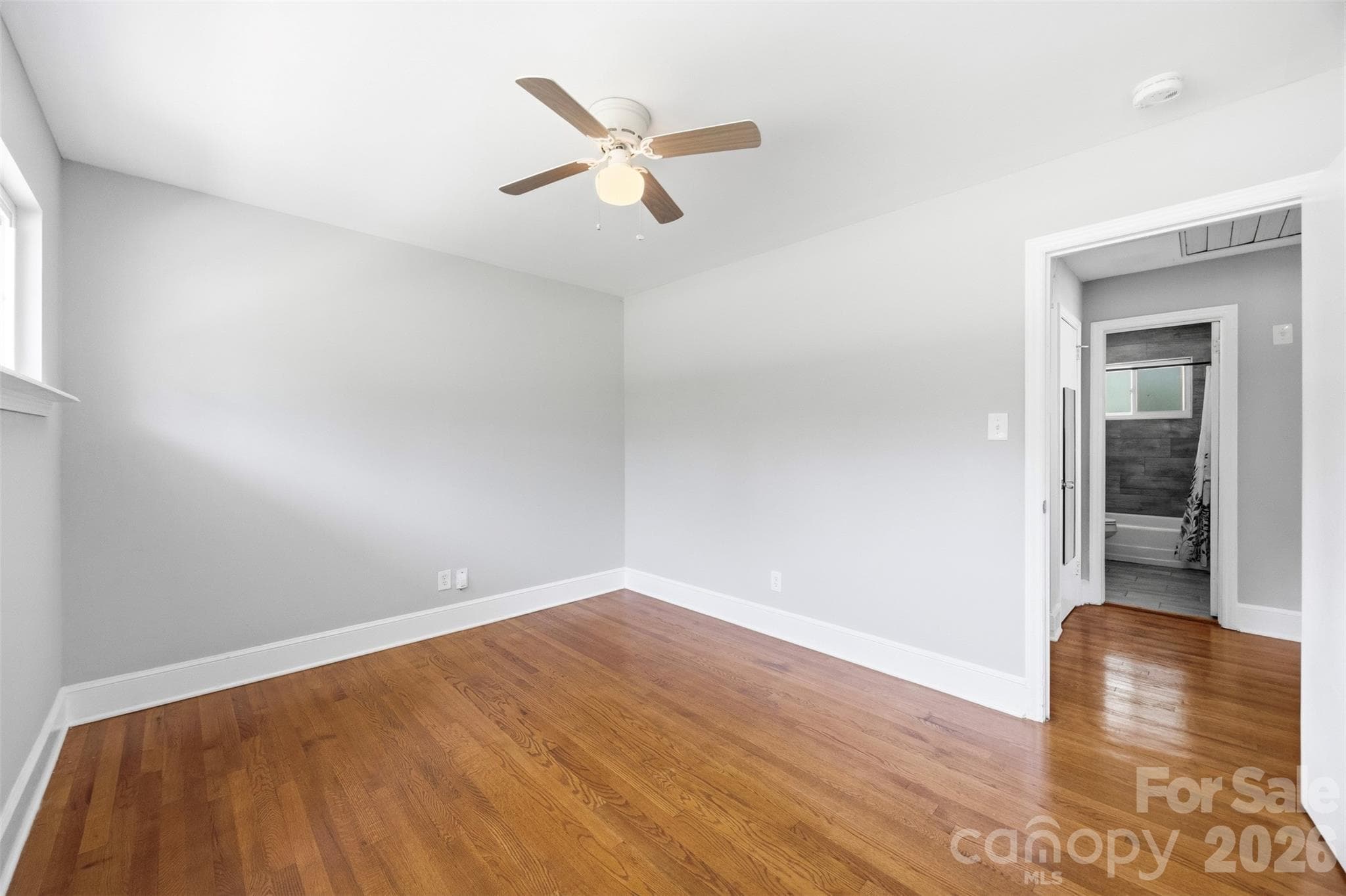 3rd look of guest BR with sneek peak out the entry door across the hall to the full bath room. - 6506 Candlewood Drive, Charlotte