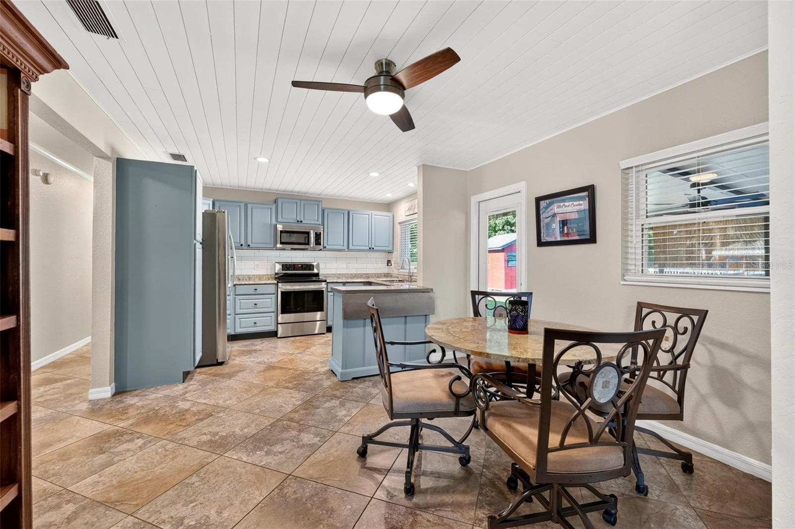 Kitchen/Dining Room Combo with shiplap ceilings - 8106 SPRING DR, YALAHA