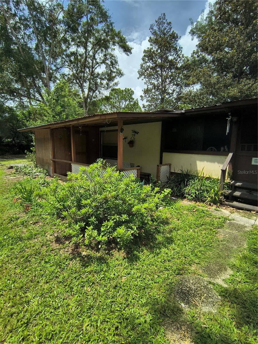 Covered porches all over - 18250 CAUFIELD RD, SPRING HILL
