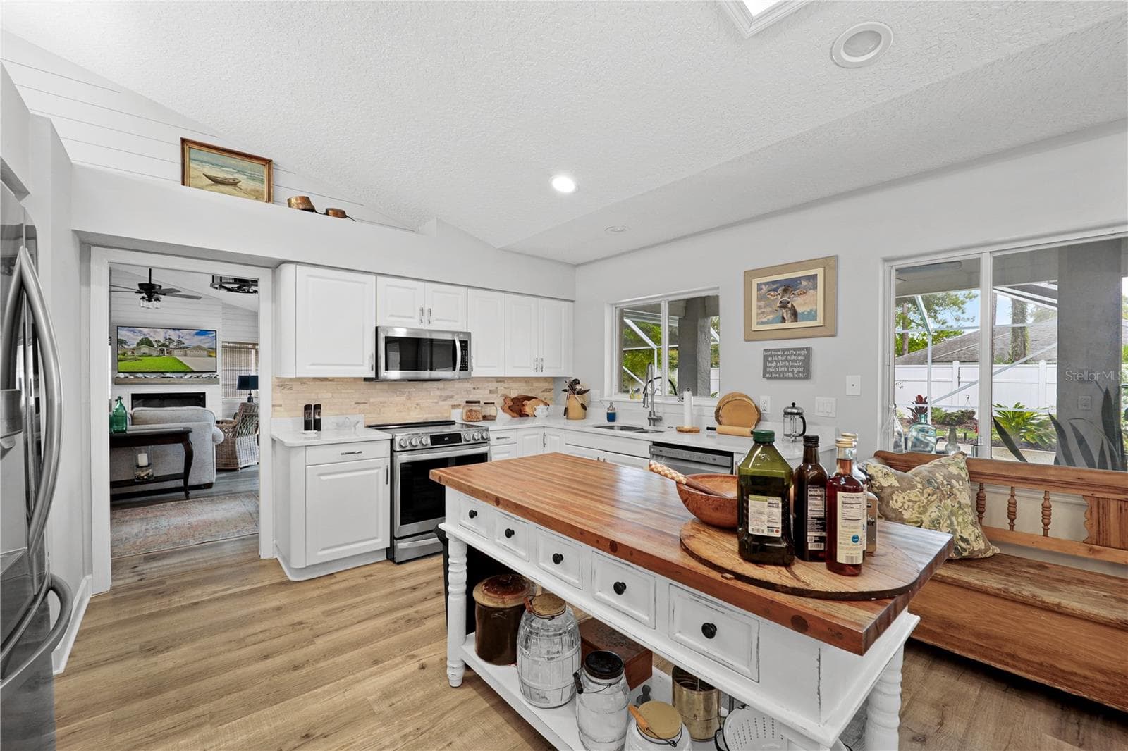 Kitchen with island - 112 WELLSTONE DR, PALM COAST