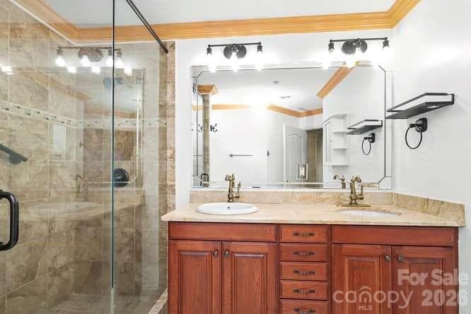Primary bath featuring double vanity and frameless glass shower - 401 N Church Street, Charlotte