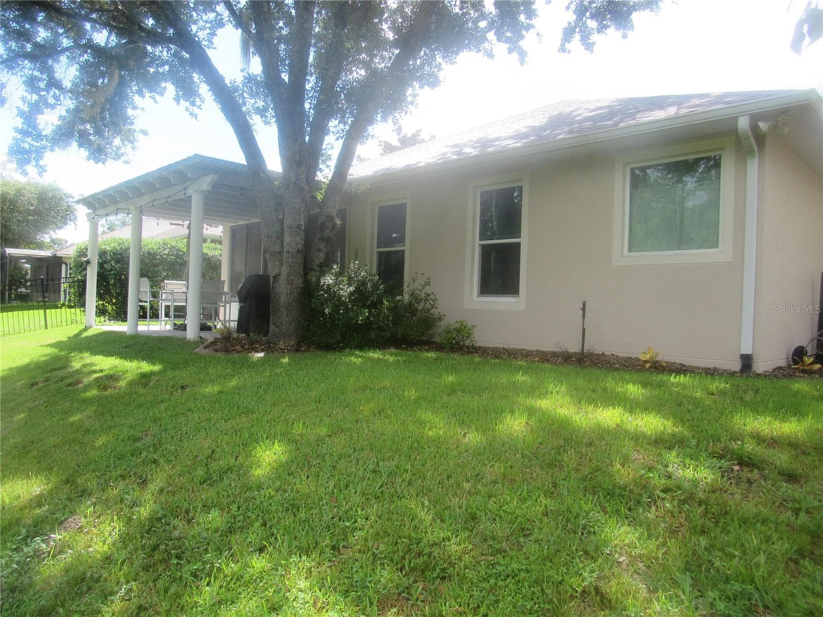 FENCED REAR YARD OVERLOOKING CONSERVATION AREA - 506 HERON POINT WAY, DELAND