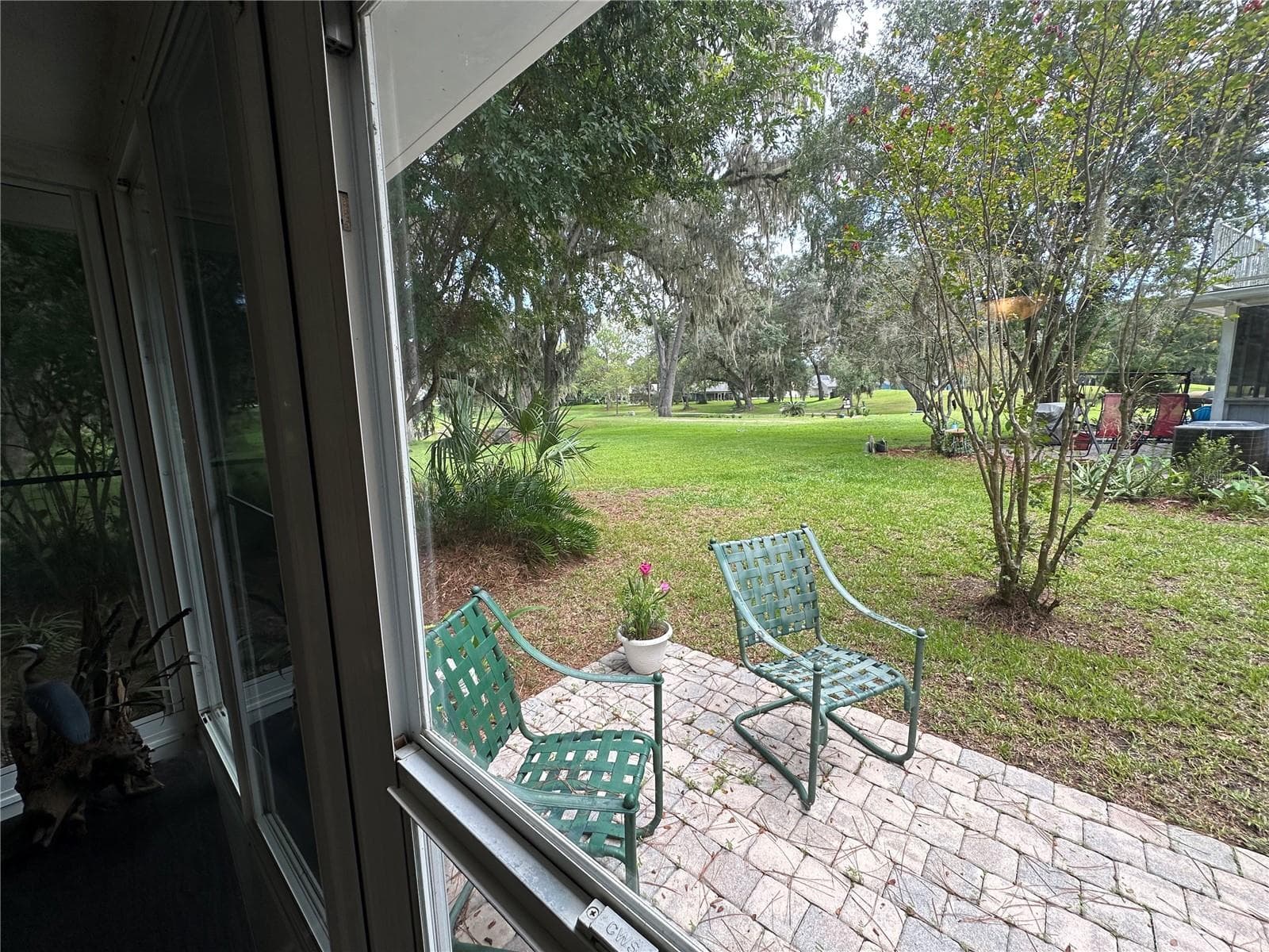 View of the 14th tee from the enclosed porch - 11793 CREEK DR, ALACHUA
