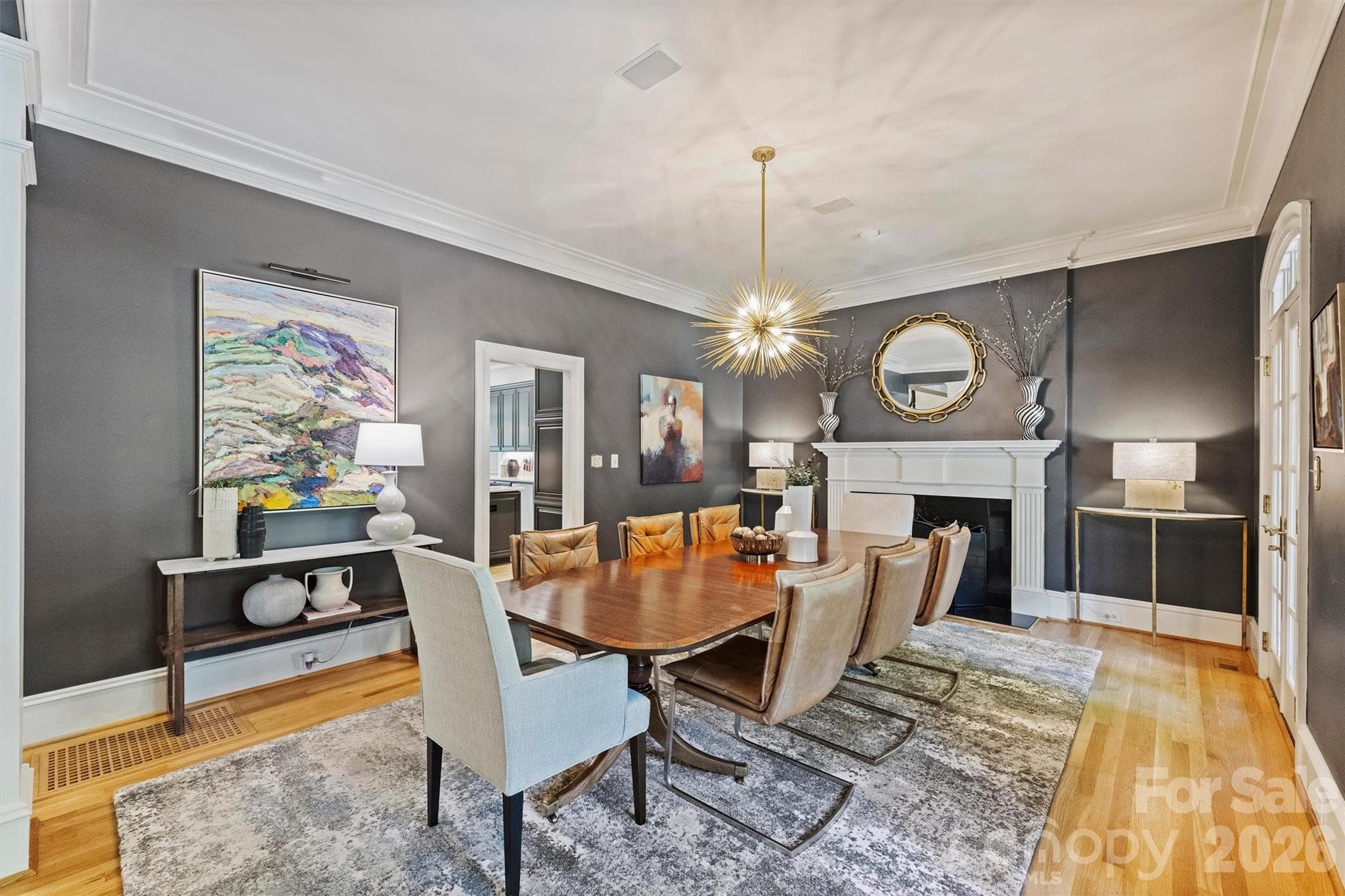 Dining Room with gas log fireplace and French doors to the front porch. - 2115 Foxcroft Woods Lane, Charlotte
