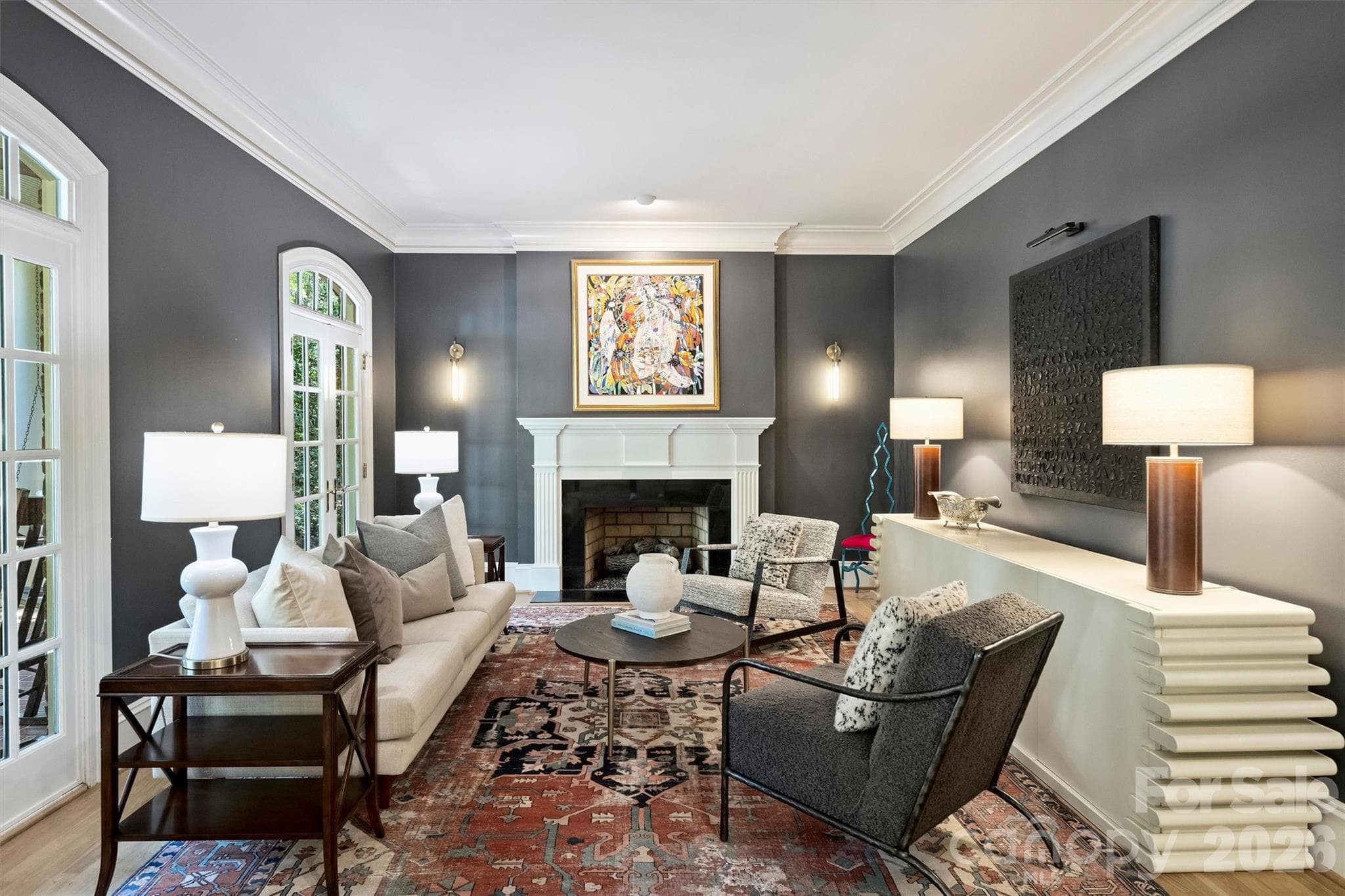 Living Room with gas log fireplace and French doors to the front porch. - 2115 Foxcroft Woods Lane, Charlotte