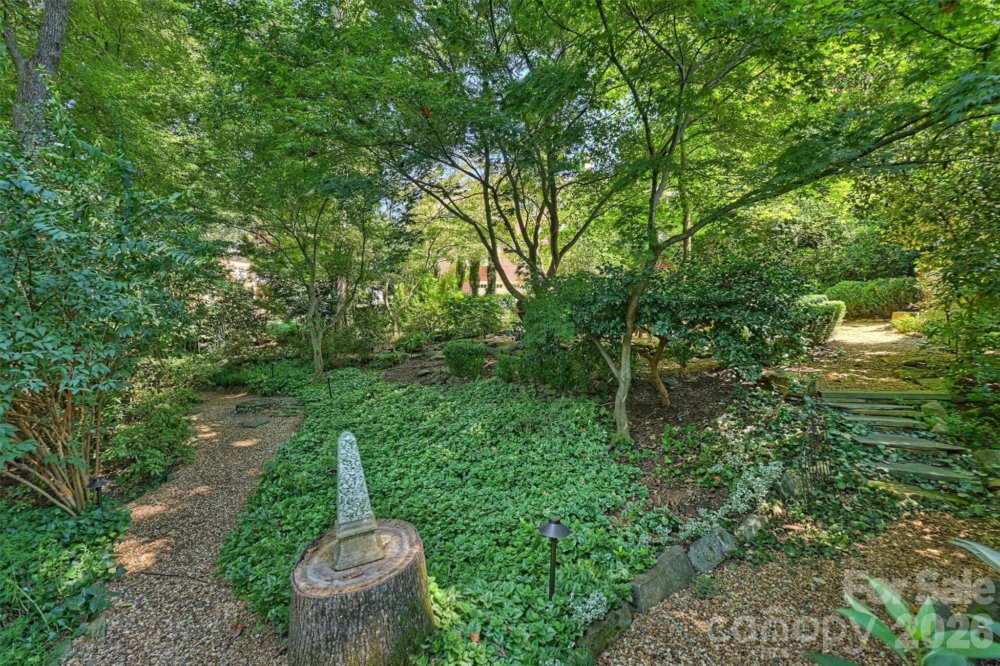 Winding trails throughout the backyard. - 2115 Foxcroft Woods Lane, Charlotte