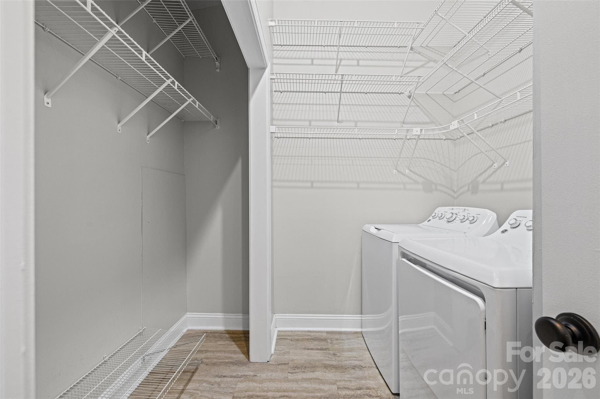 Massive laundry room in primary closet with vertical storage - 4160 Charlotte Highway, Lake Wylie