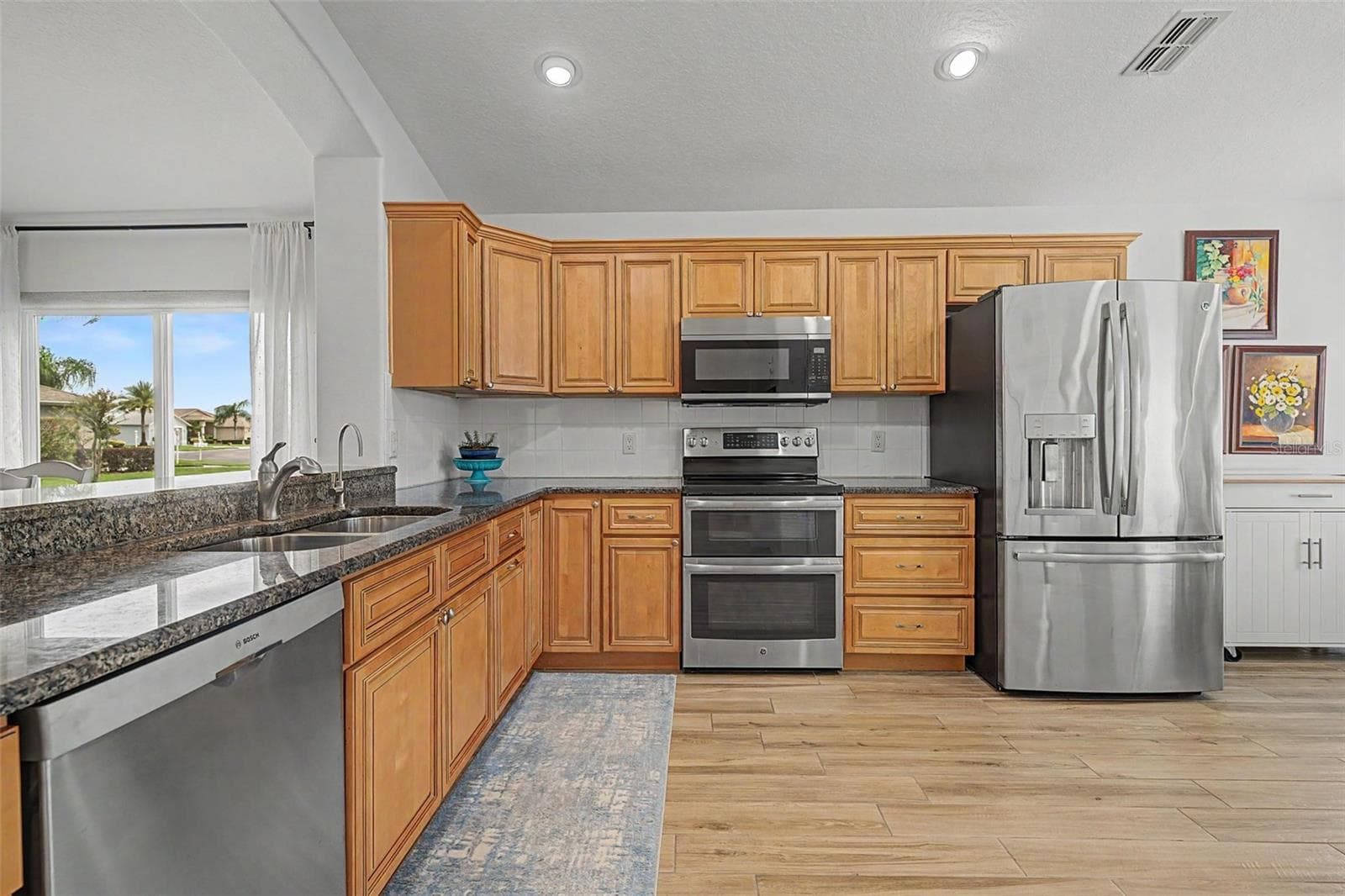 Updated kitchen with tons of storage options - 12027 FERN TERRACE CT, TRINITY