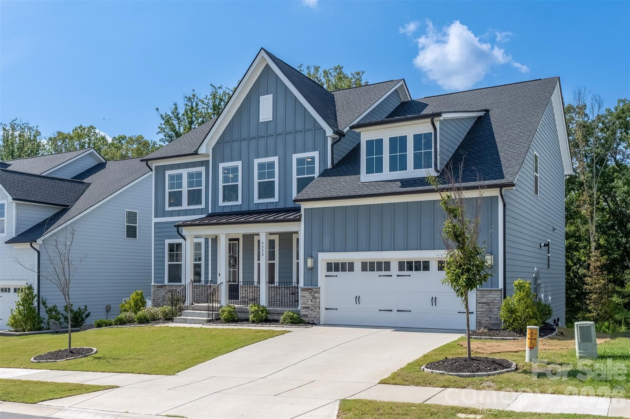Front elevation with two-car garage - 4320 Tournette Drive, Indian Land