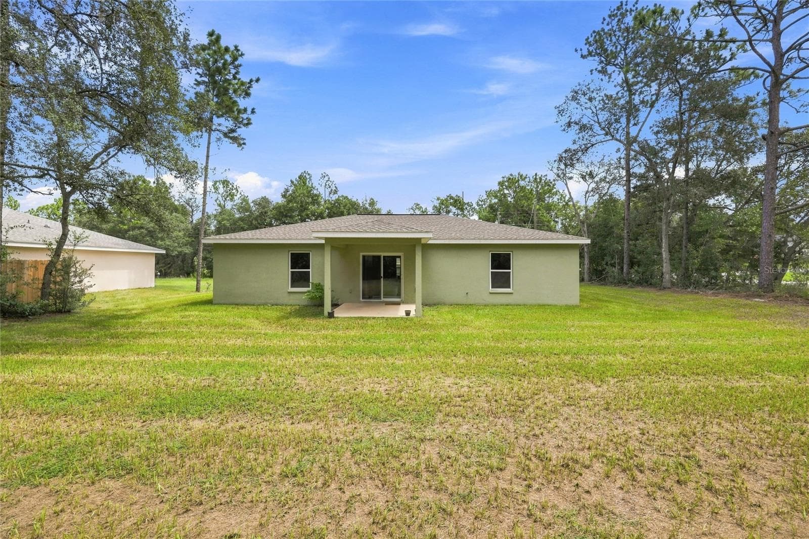 Back of Home - 7390 N IRELAND DR, DUNNELLON