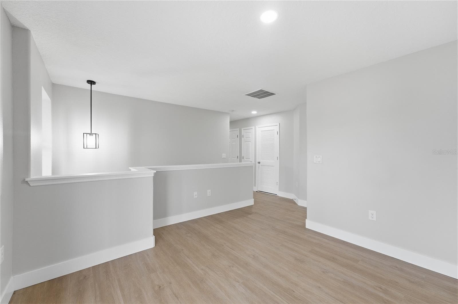 View from the spacious loft toward the upstairs bedroom hallway. - 2615 GIARDINO LOOP, KISSIMMEE