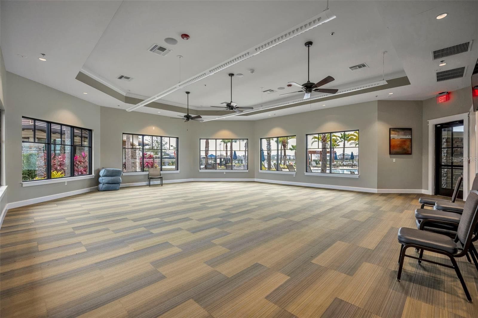 Spacious community gathering room overlooking the resort-style pool. - 2615 GIARDINO LOOP, KISSIMMEE