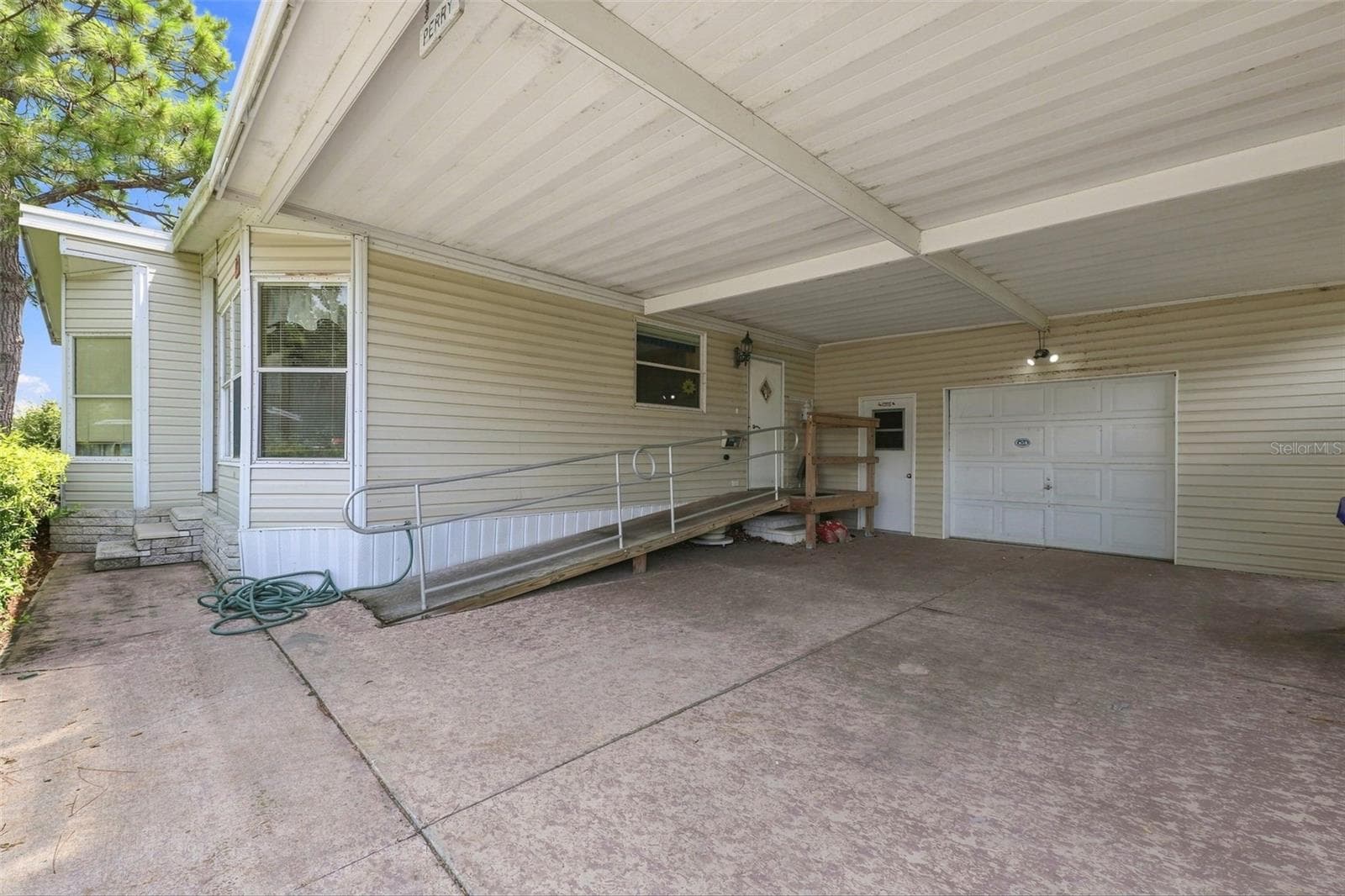 Large carport with HUGE oversized garage/workshop. - 3215 WEKIVA RD, TAVARES