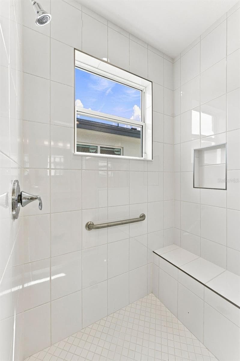 Master Bathroom Walk-In Shower Featuring Bench Seating, Grab Bar & Window For Lots of Natural Lighting - 3427 MALTA AVE, WESLEY CHAPEL