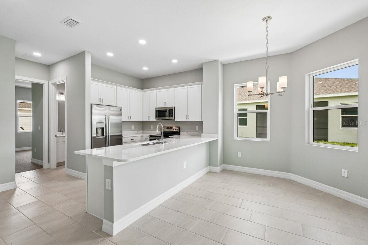 Kitchen-Photo description represents the model home of same floor plan. - 1855 NOTTINGHAM TRL, PORT CHARLOTTE