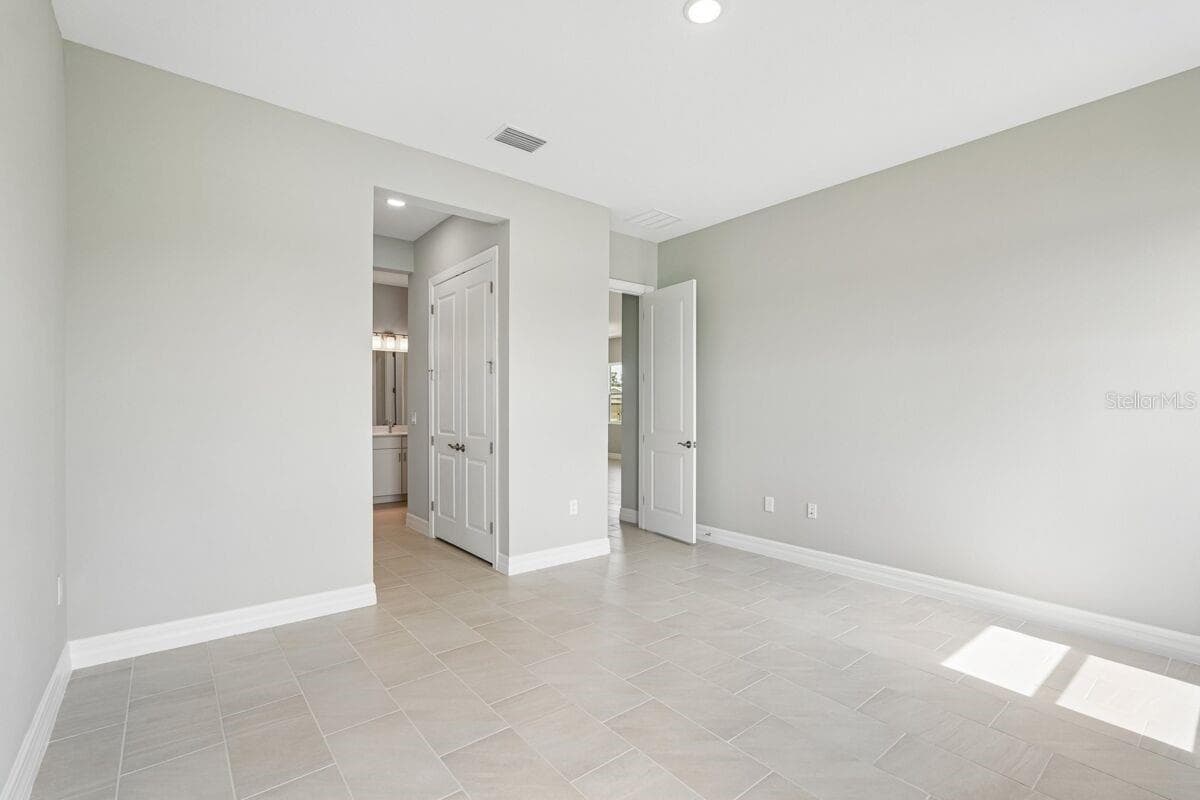 Owners Bedroom-Photo description represents the model home of same floor plan. - 1855 NOTTINGHAM TRL, PORT CHARLOTTE