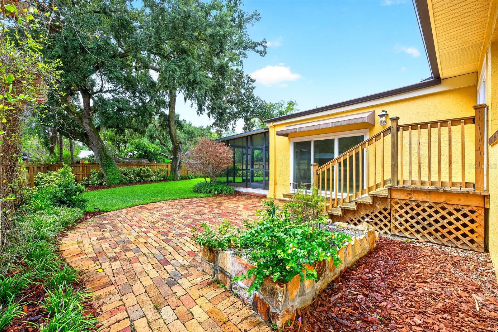 Outside of the screened lanai there is also a paver patio. - 1212 ELMWOOD ST, ORLANDO