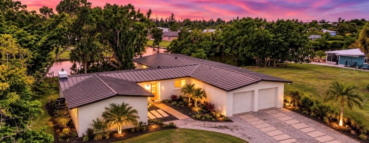 Virtually staged driveway and landscaping - 801 MARLIN DR, PUNTA GORDA
