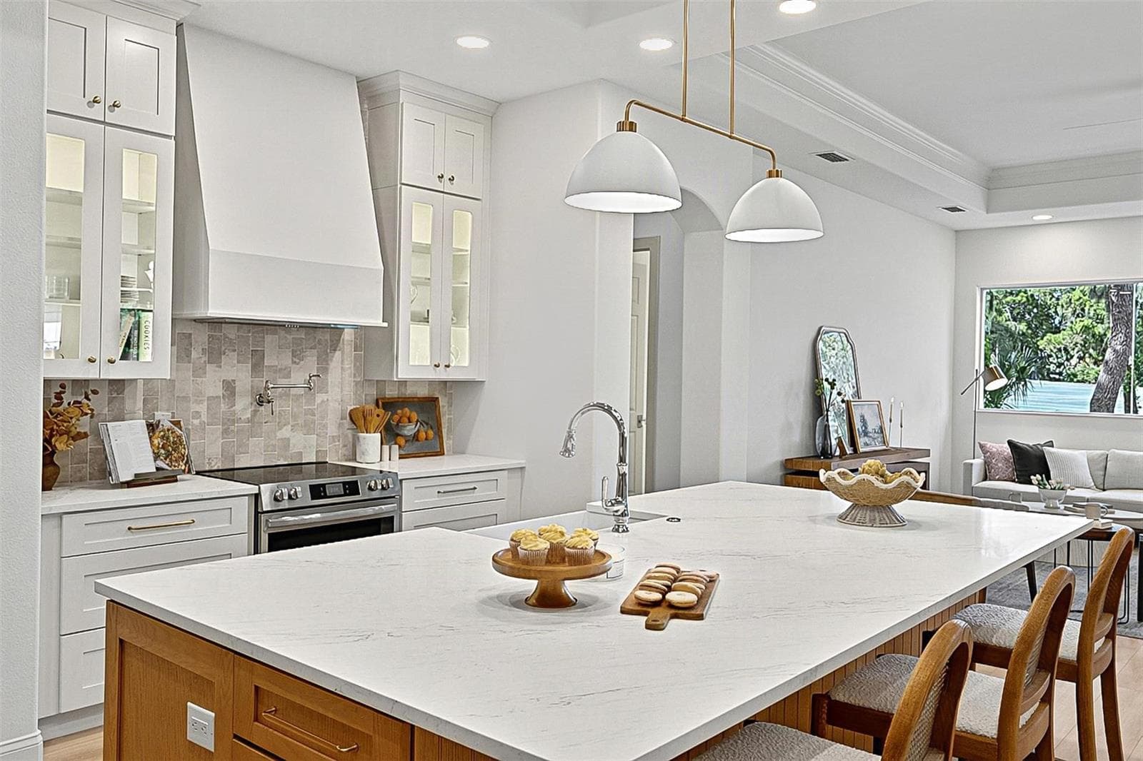 Elegant Centerpiece Kitchen Island with crafted wall of tile and lighted window cabinets - 17 GRANDVIEW DR, PALM COAST