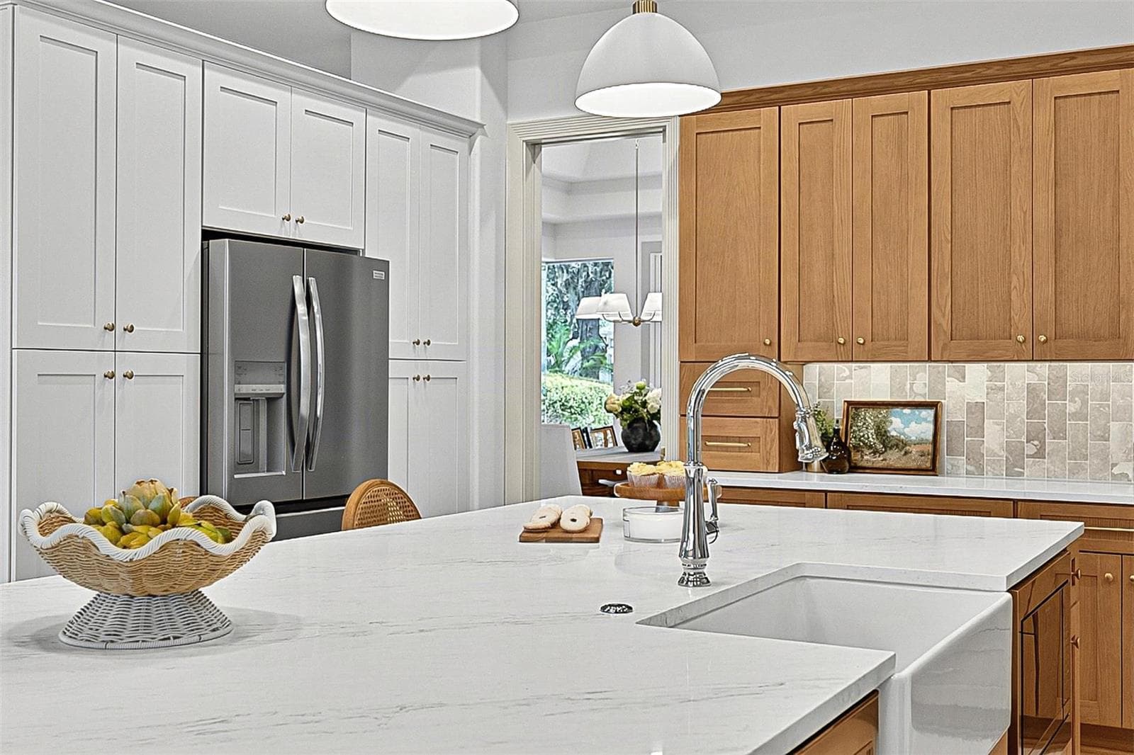 Kitchen Island with farm sink, showing refrigerator with wall of pantry cabinets - 17 GRANDVIEW DR, PALM COAST