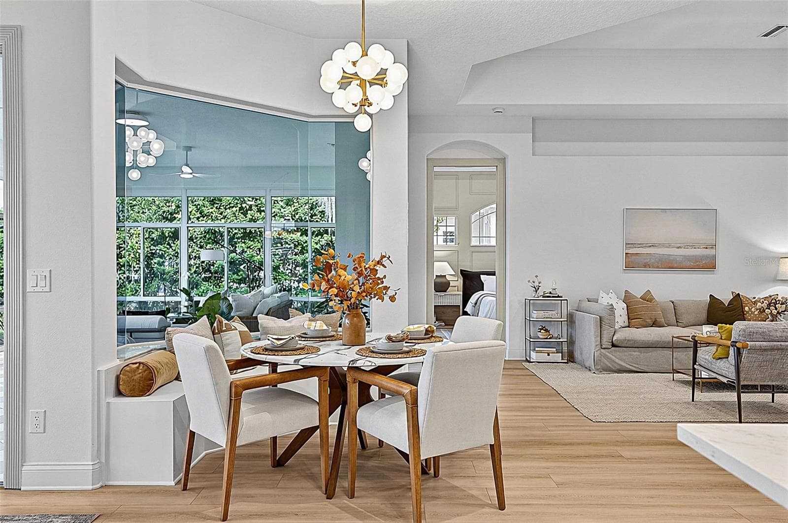 Beautiful Breakfast nook with custom window seating looking our to solarium and righ off formal living room - 17 GRANDVIEW DR, PALM COAST