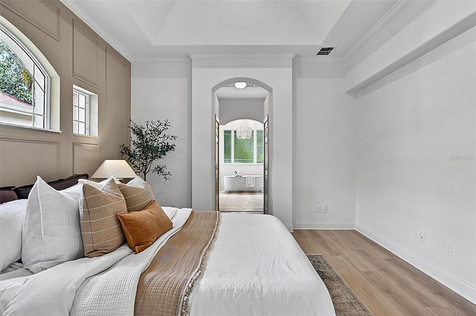 A piece of heaven in the Master Bedroom Retreat with transient window bringing in natural light. Sliders go out to the solarium and into stunning Master Bath Retreat - 17 GRANDVIEW DR, PALM COAST