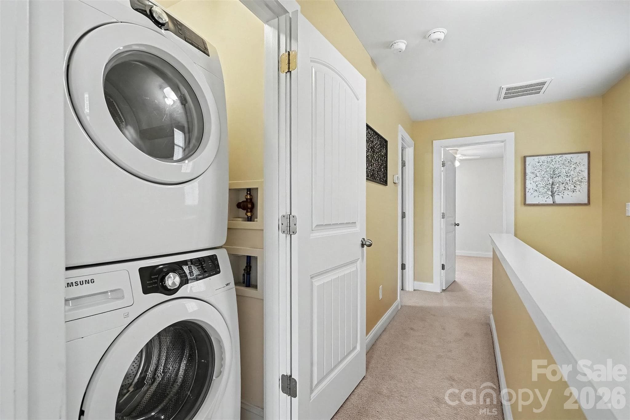 Hall laundry closet - stackable washer and dryer convey - 13913 Helen Benson Boulevard, Davidson