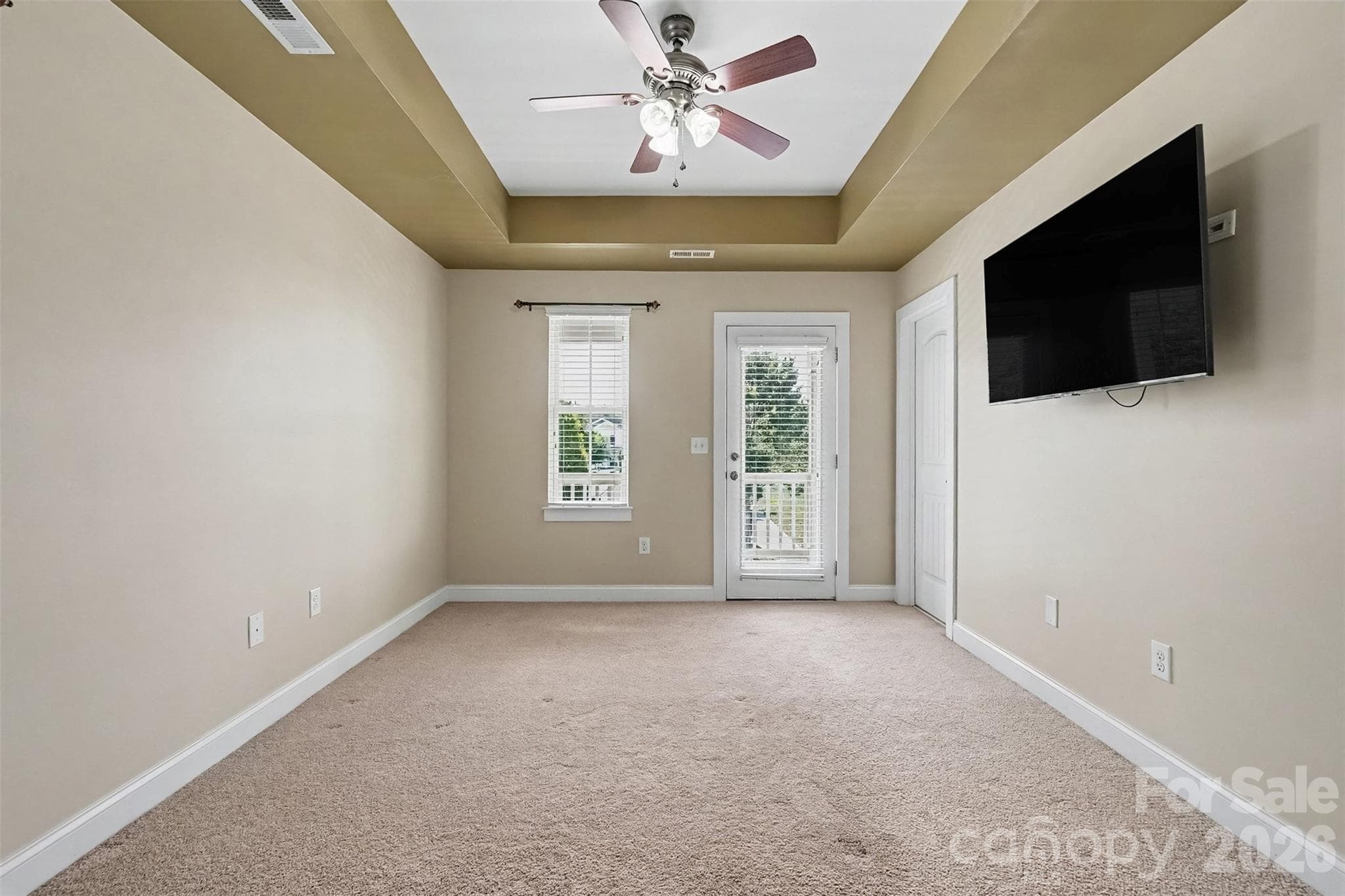 Primary Bedroom with access to private covered front porch - 13913 Helen Benson Boulevard, Davidson