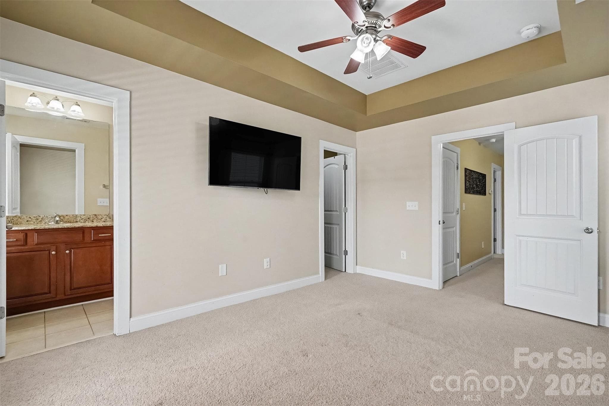 Primary Bedroom with tray ceilings/ walk in closet - 13913 Helen Benson Boulevard, Davidson