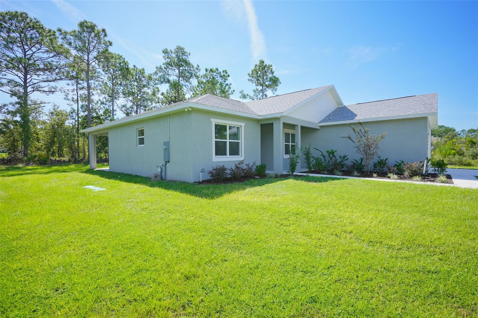 Front Exterior - 17460 MACASSAR RD, WEEKI WACHEE