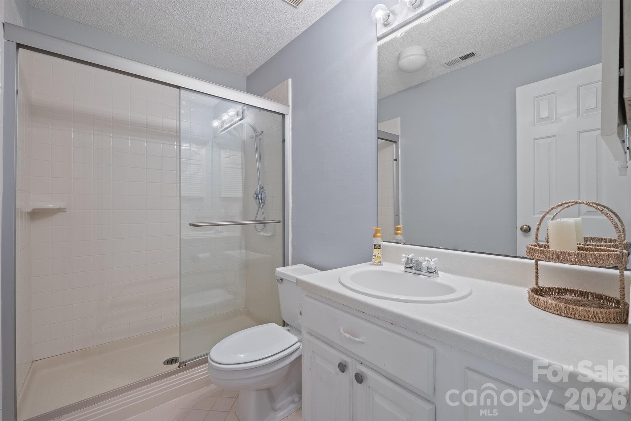 2nd full bath, updated glass shower door accessed via the hall - 327 Northwest Drive, Davidson
