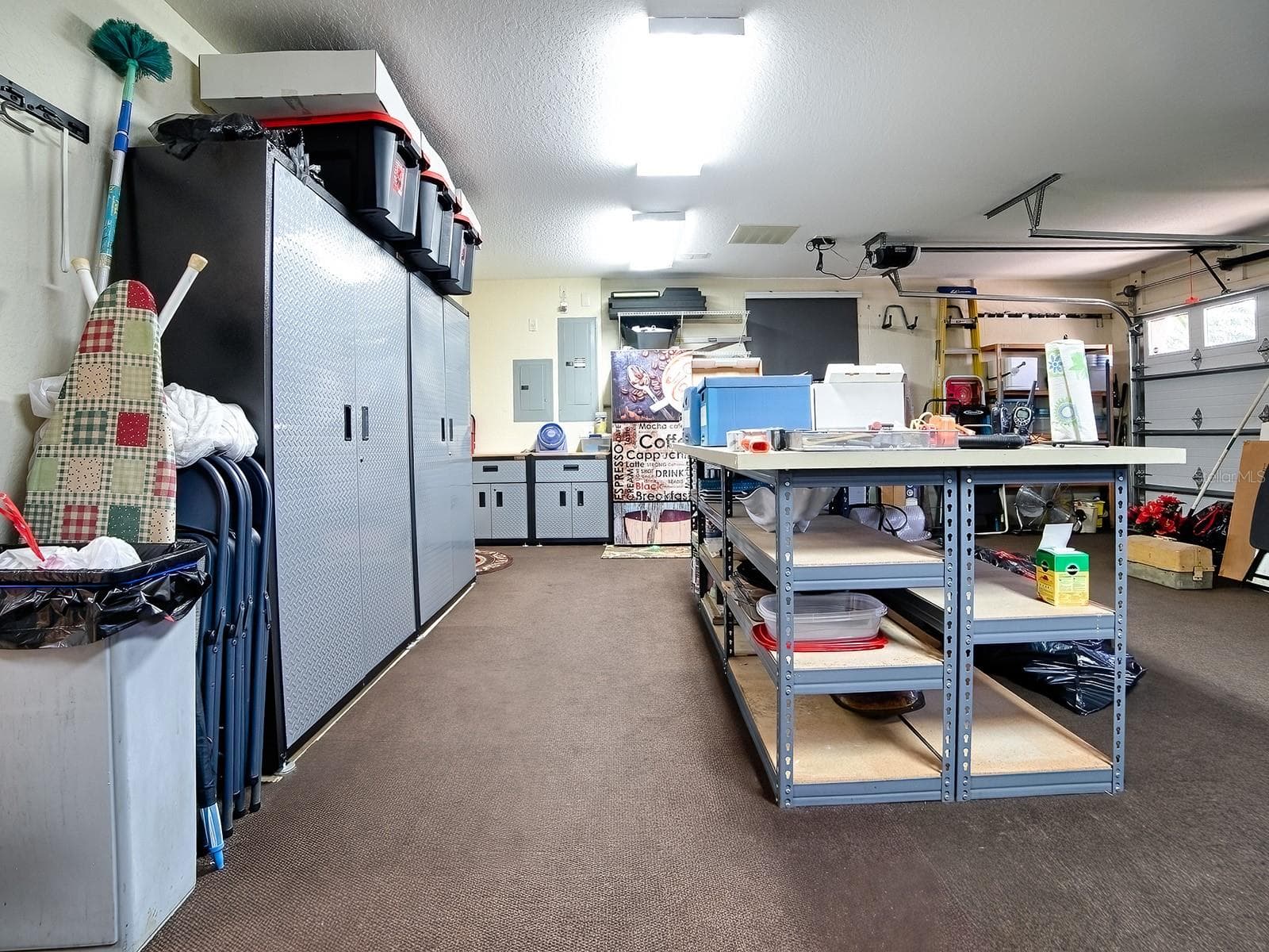 A HOBBYIST'S DELIGHT - AN ORGANIZED AND EXPANDED GARAGE - 1089 VANCE TRL, THE VILLAGES