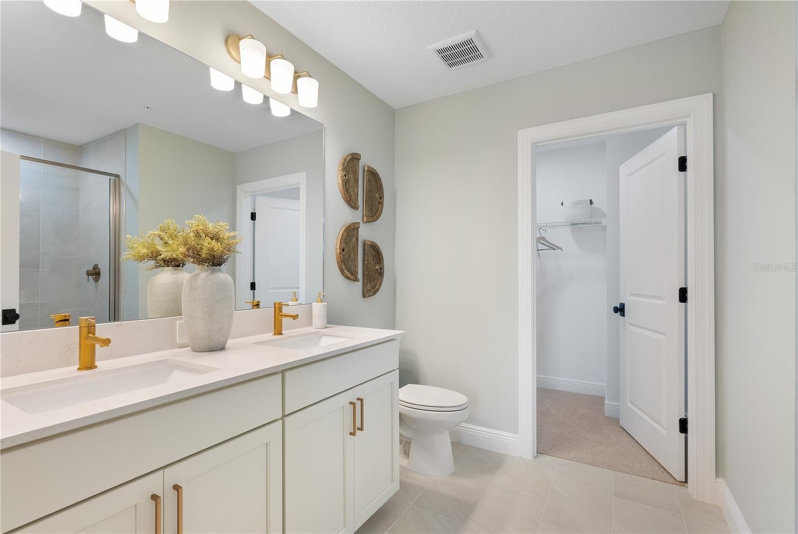 Primary Bath:Photo description represents the model home of same floor plan. - 17836 BROADLEAF LOOP, VENICE