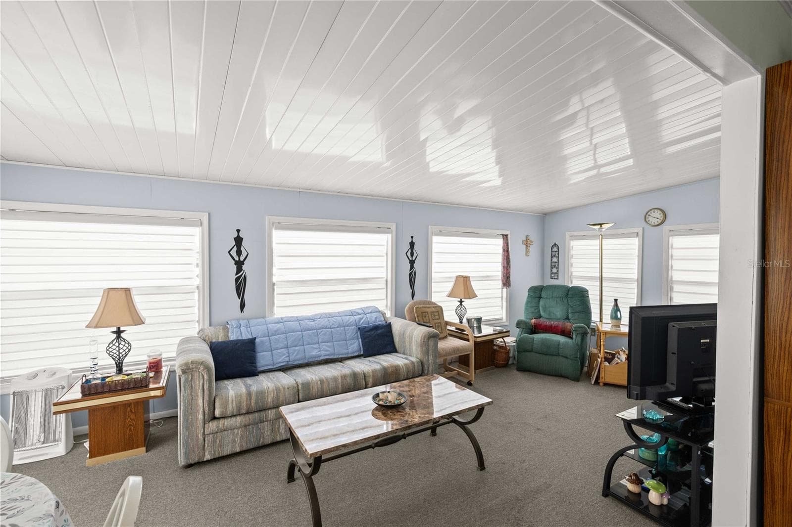 The living room is just off the dining space - 36917 GRACE AVE, ZEPHYRHILLS