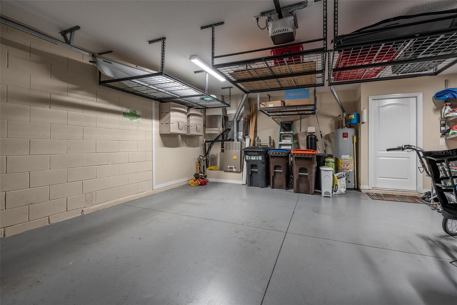 Garage with hanging Storage Racks - 16320 SW 13TH TER, OCALA
