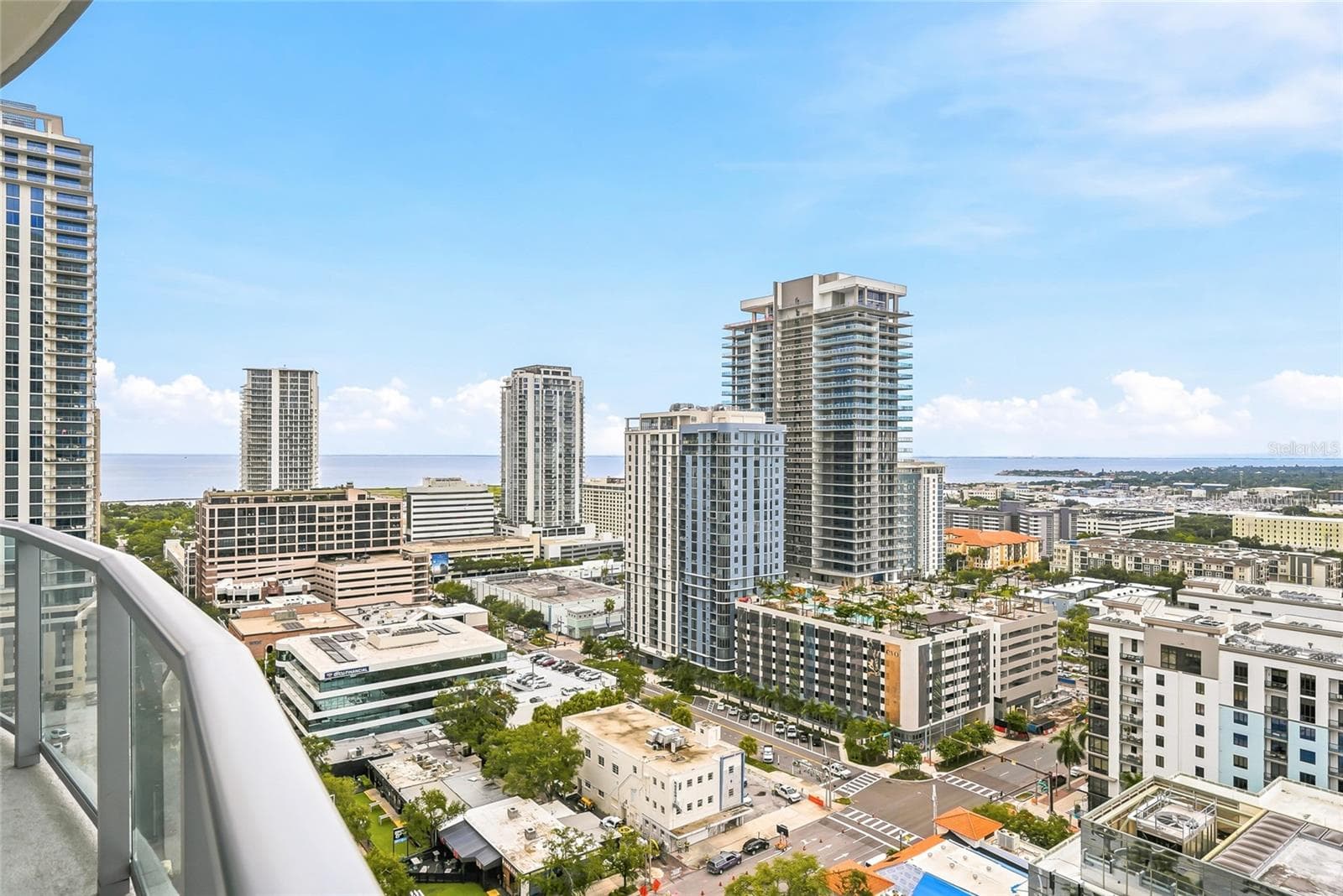Beautiful water and city views from the primary bedroom’s private terrace. - 400 CENTRAL AVE #1901, ST PETERSBURG