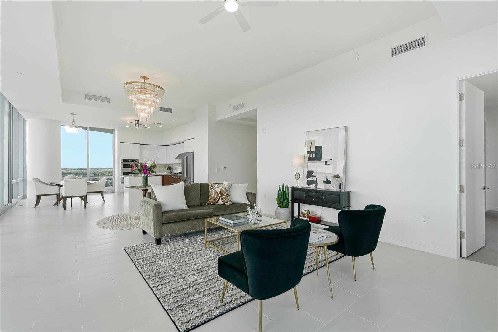 Open-concept living space. The door to the right leads to the primary suite. - 400 CENTRAL AVE #1901, ST PETERSBURG