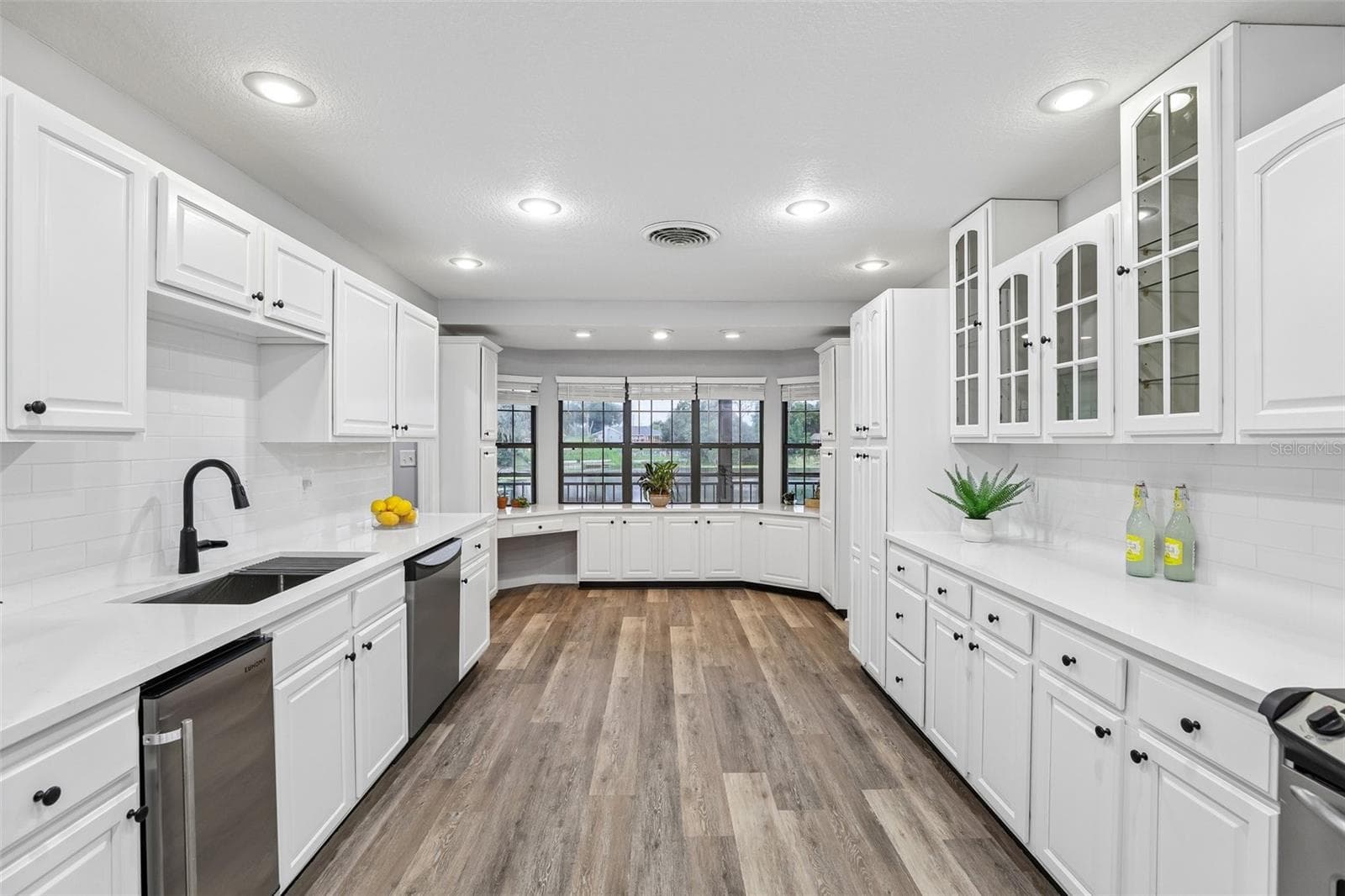 Freshly updated Kitchen-Feashly painted cabinets, Quartz counters, subway tile, undermount sink, hardware and new faucet. - 1460 GROVE ST, EUSTIS
