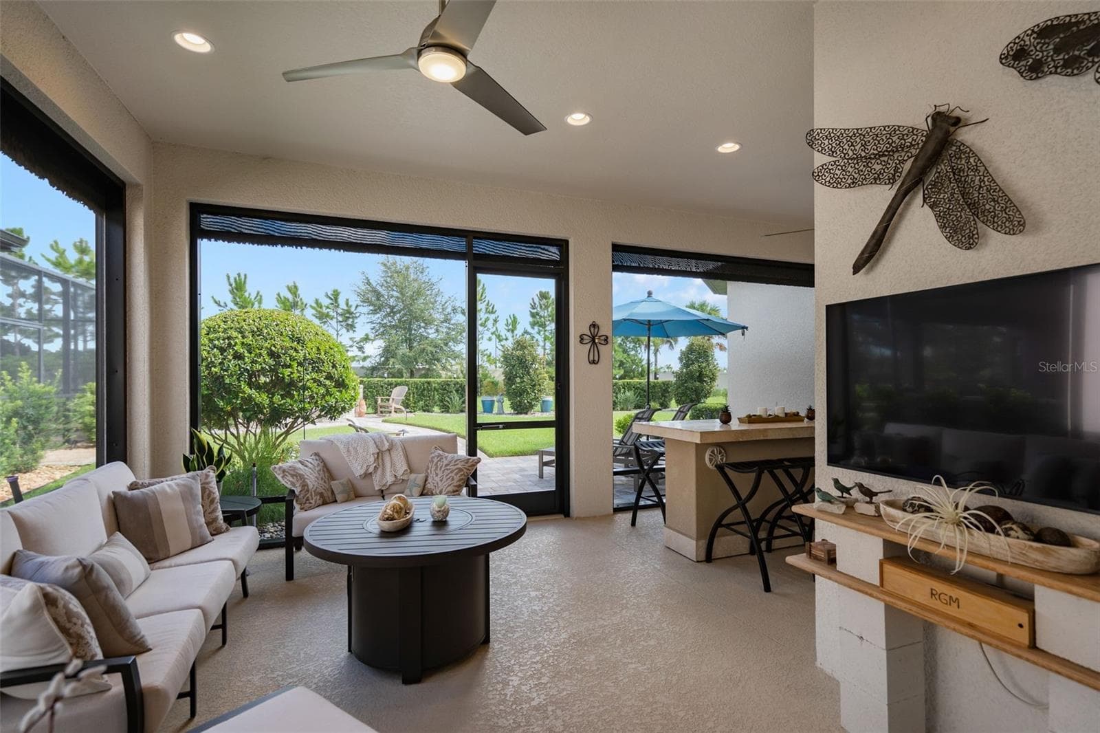 The screened lanai also has Power Roll Down Shades. Wait until you see what is around the corner. - 1279 ZEEK RIDGE ST, CLERMONT