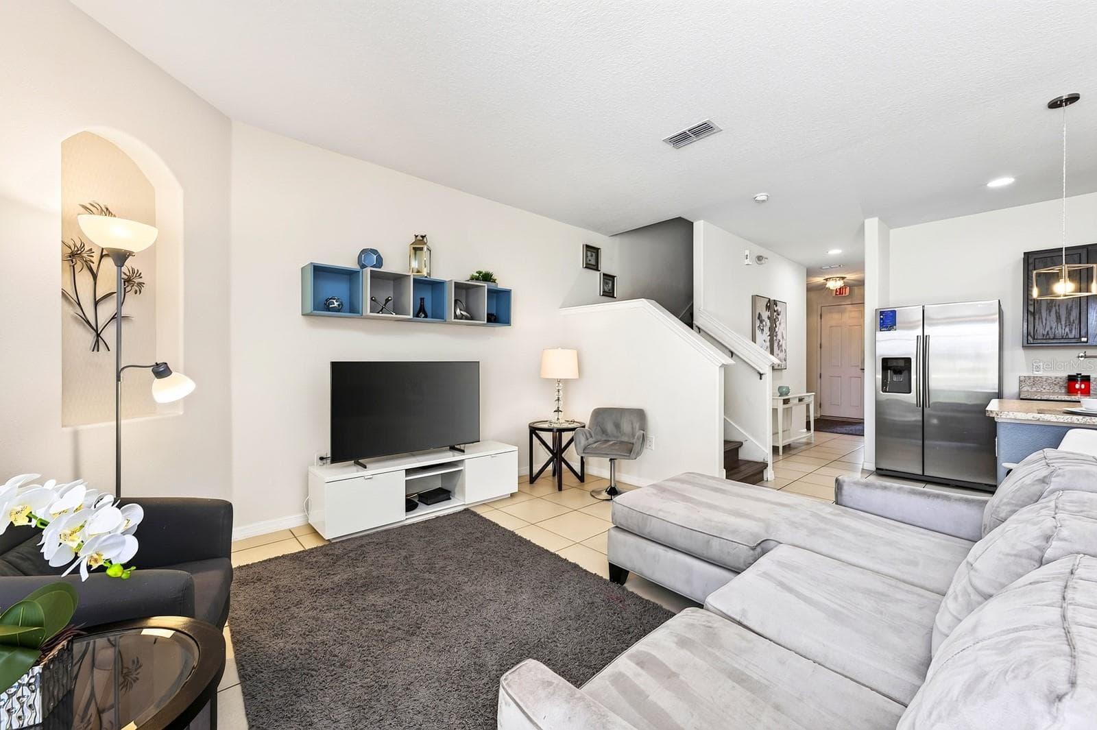Inside, the main floor delivers a bright and spacious OPEN CONCEPT layout with the Living Room, Dining Area and Kitchen flowing seamlessly together. - 4722 TERRASONESTA DR, DAVENPORT