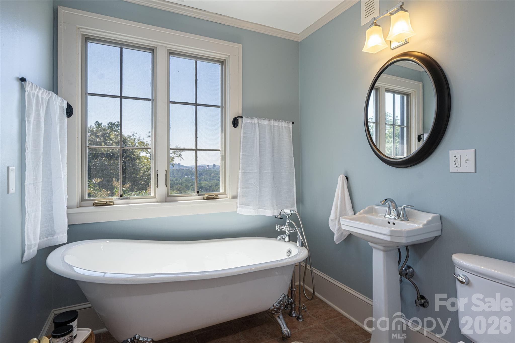 The second guest bathroom on the upper level features stunning views of downtown while you relax - 35 Elias Place, Asheville