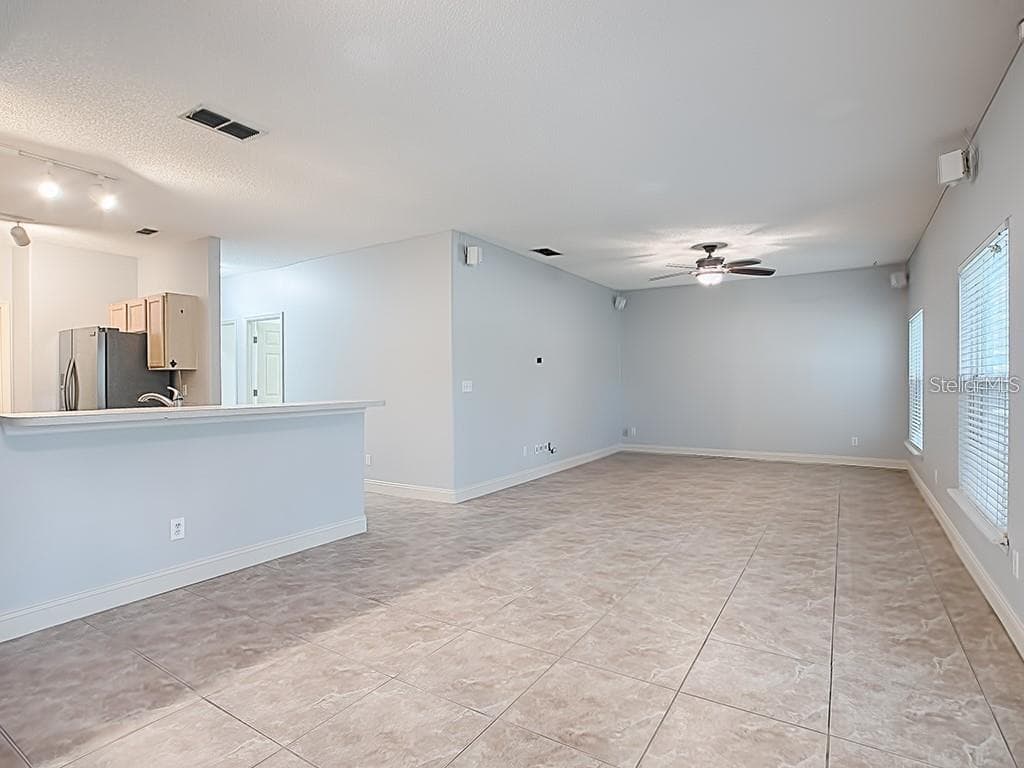 Living Room view from breakfast nook - 1306 RAIN FOREST LN, MINNEOLA