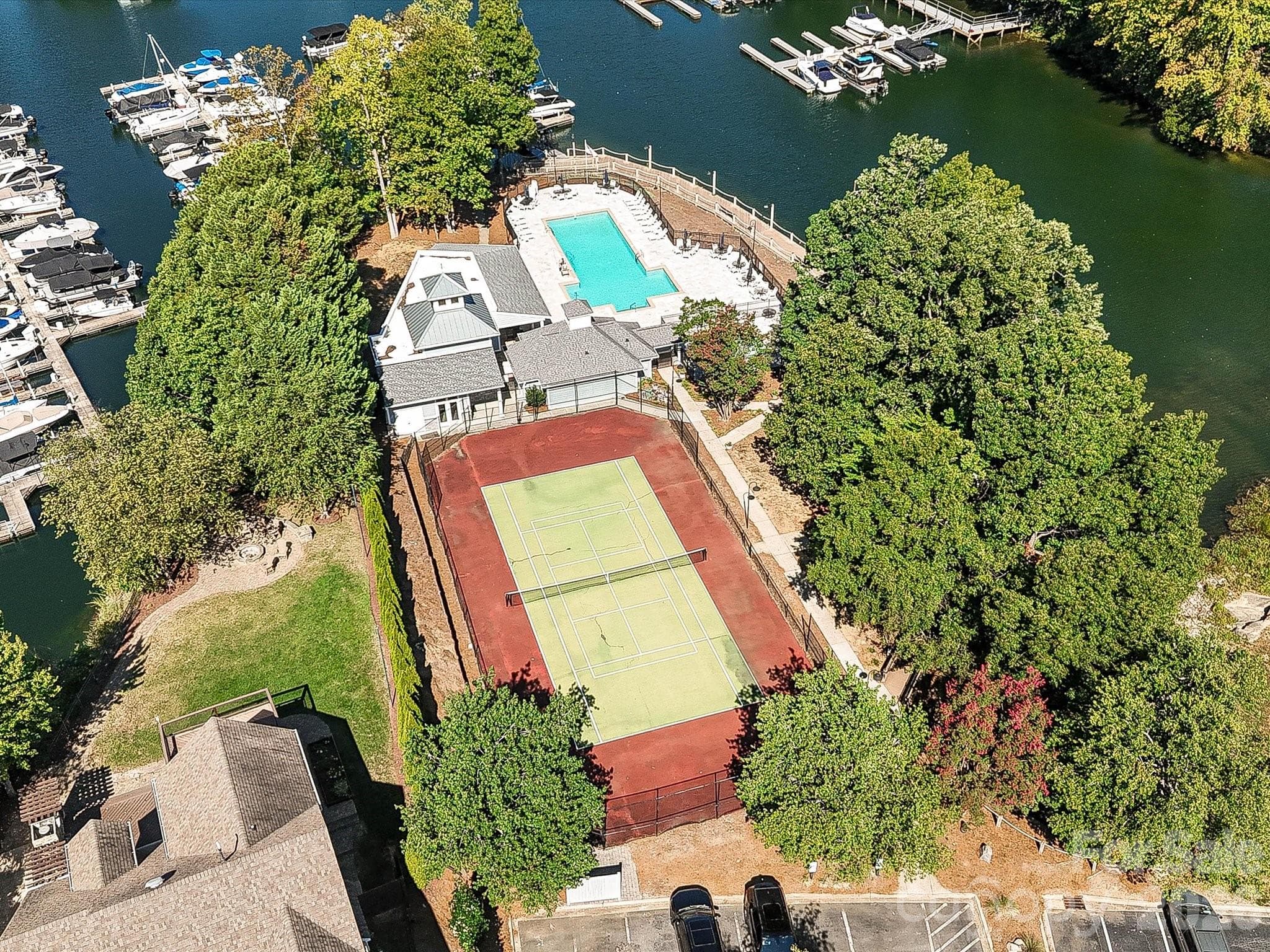 Aerial view showcases Blue Stone Harbor's pool, tennis courts, marina, and desirable Lake Norman community setting. - 19706 Valiant Way, Cornelius